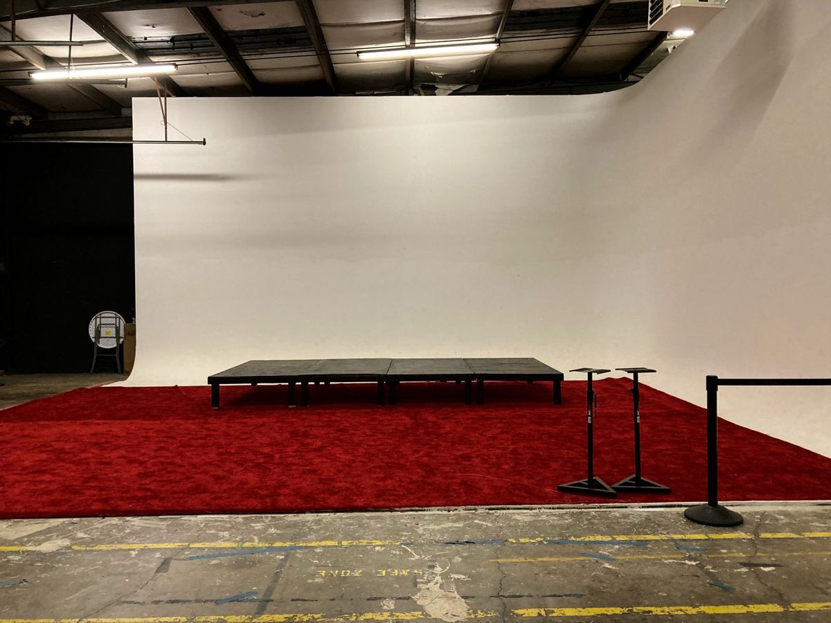 The Dope Coffee event stage with a red carpet