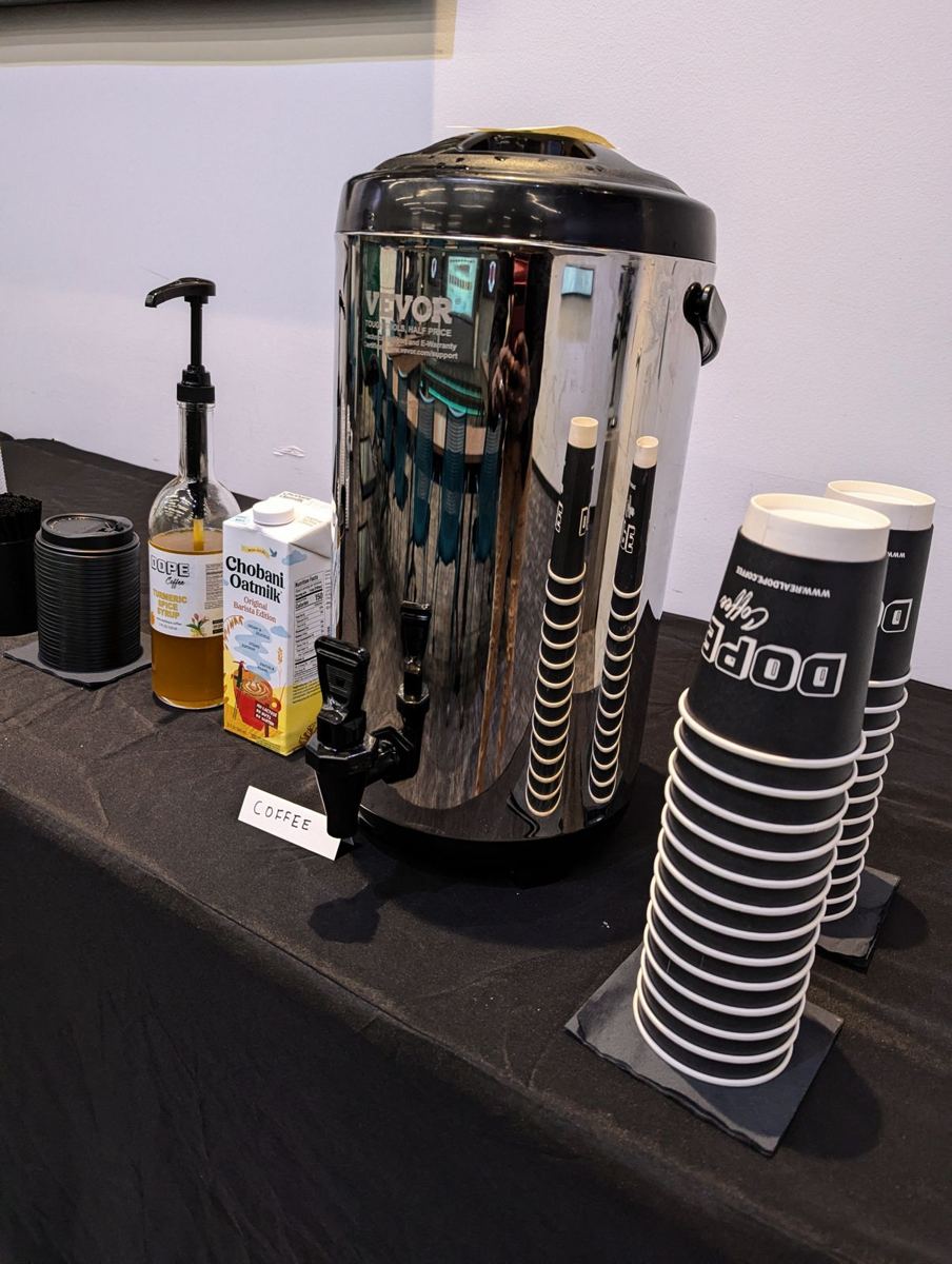 A Dope Coffee urn and Dope cups set up for an office event