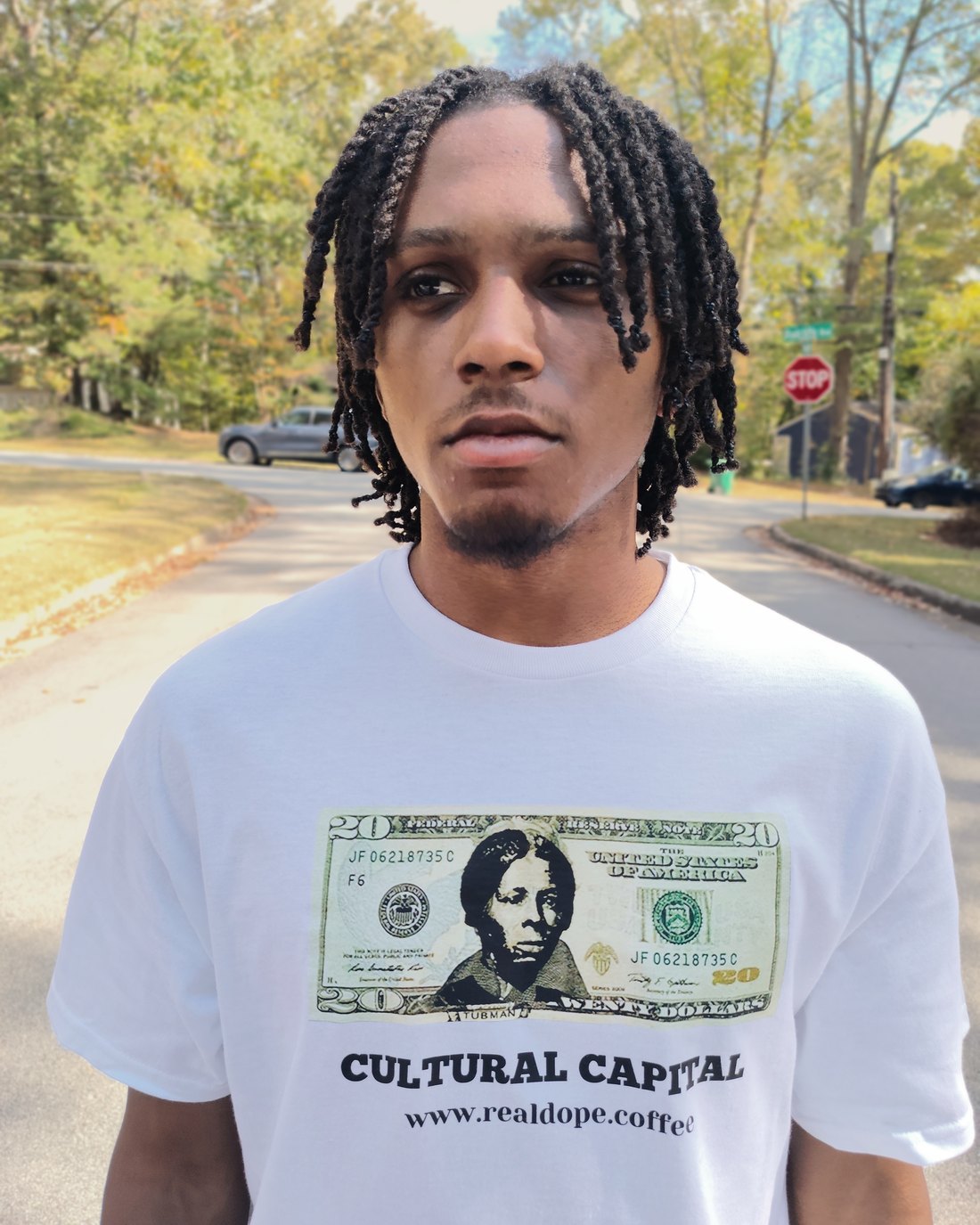 Jayden in the Cultural Capital tee: the Harriet Tubman twenty on the chest